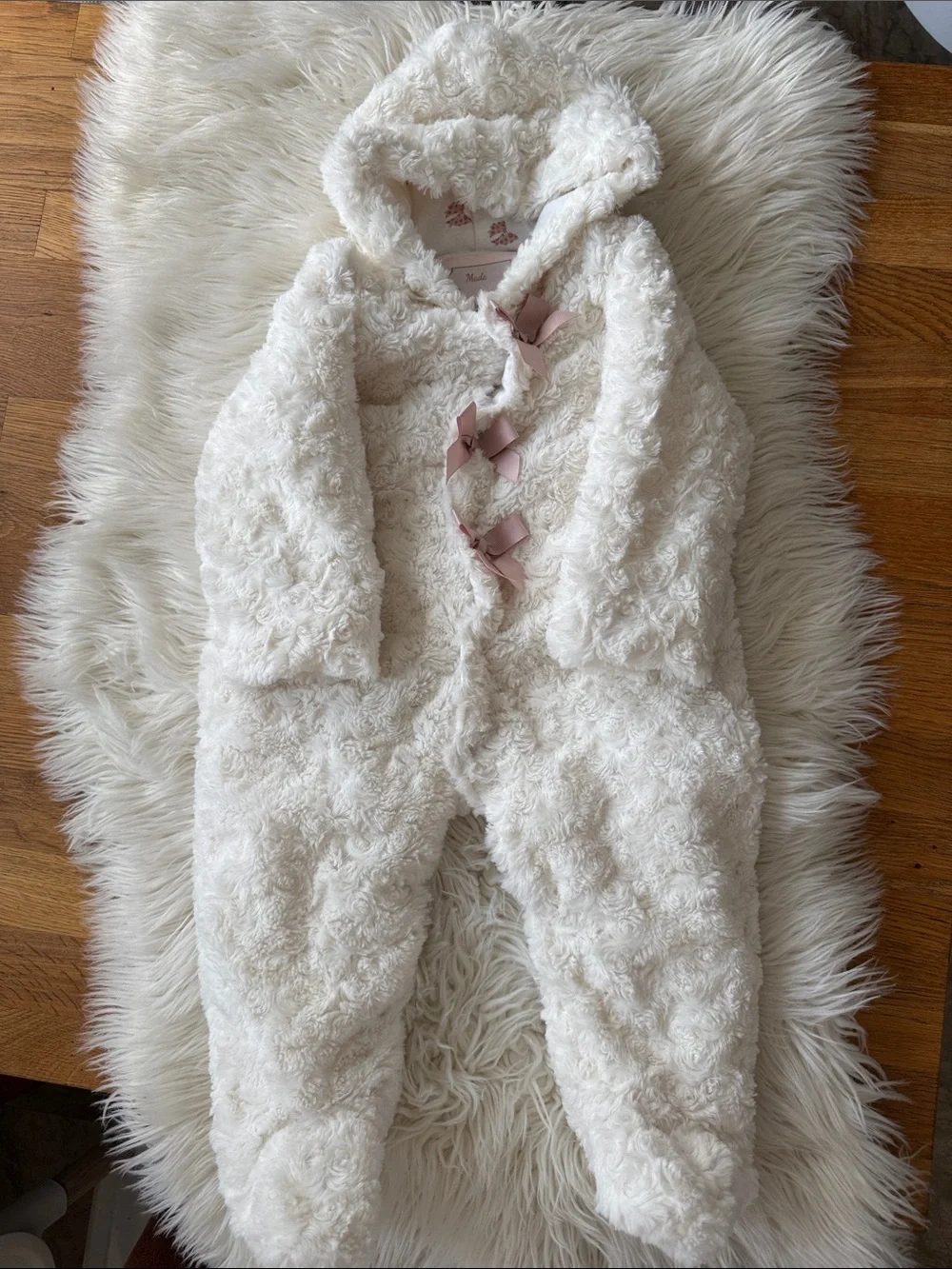 Plush Cream Hooded Baby Onesie with Pink Ribbon Closures